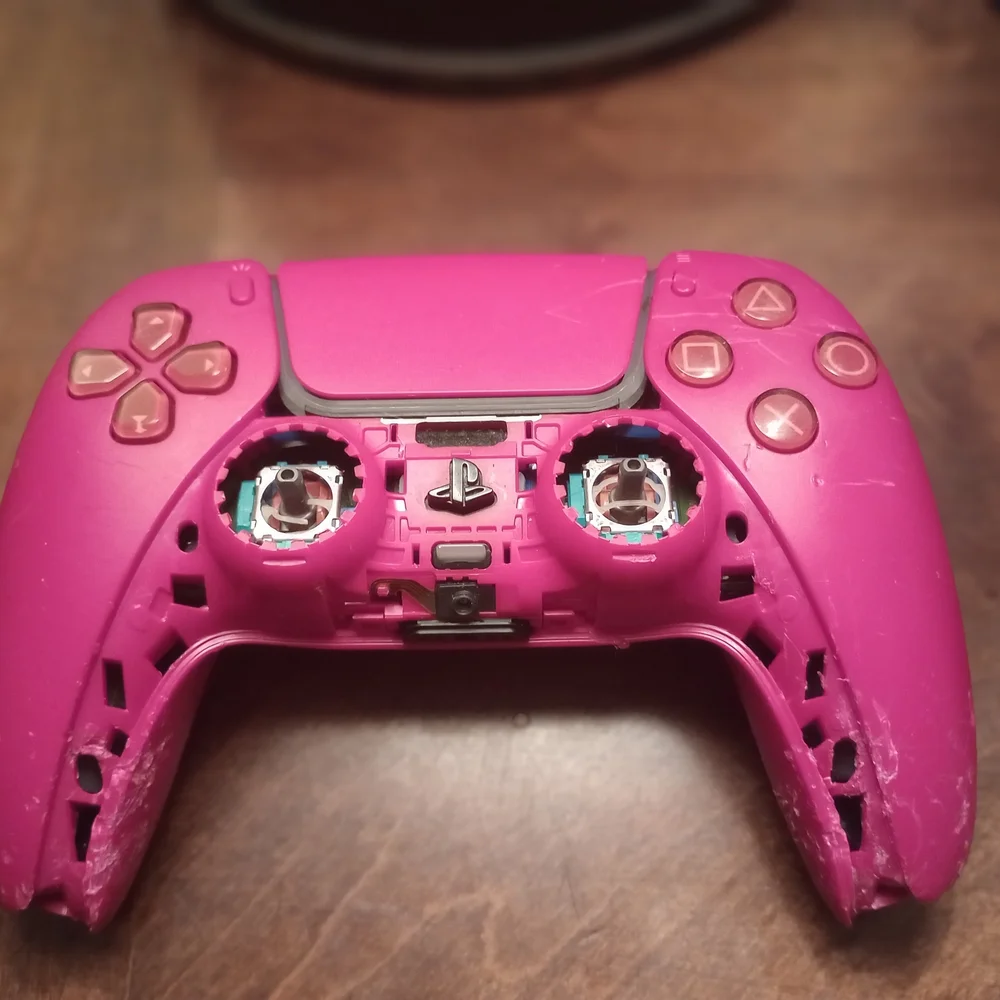 Gray and Pink Video Game Controllers